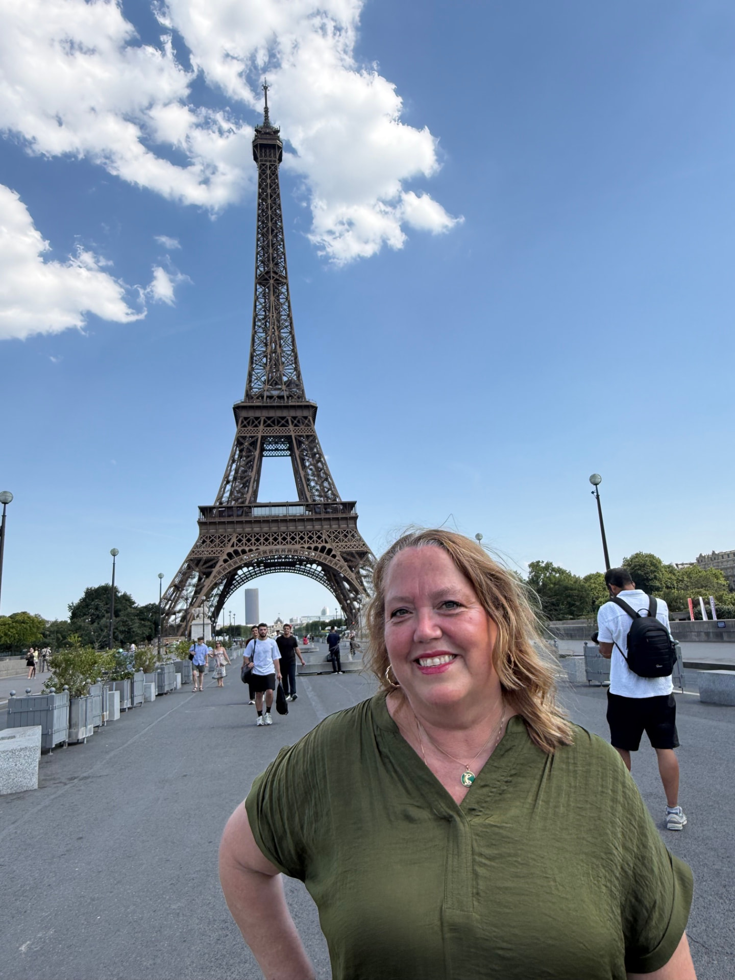 Christine Scheeler in front of the Eiffel Tower at the Trocadéro in Paris