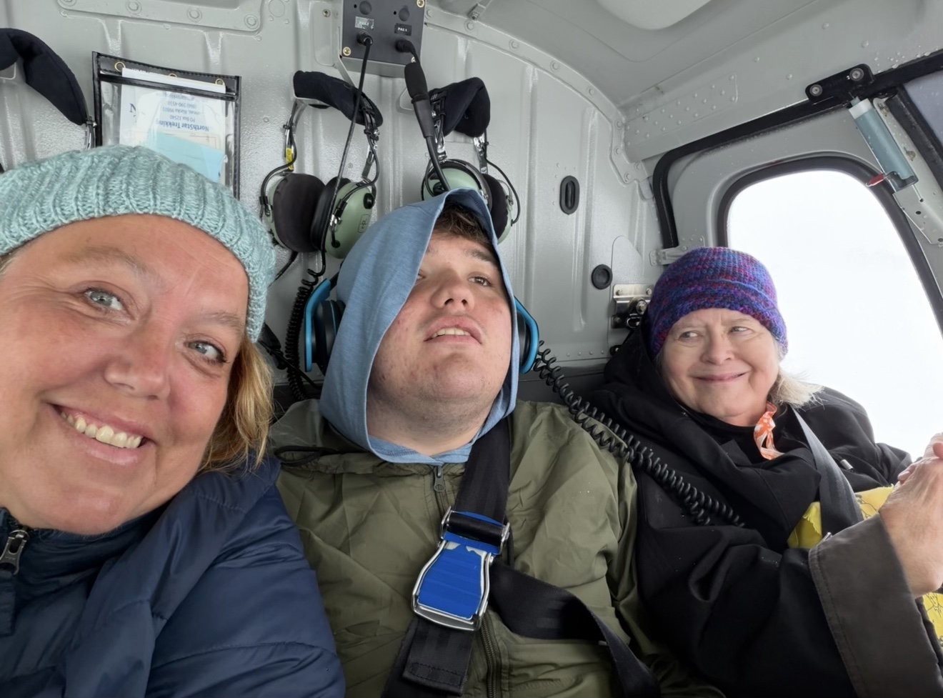 Three generations of Christine Scheeler's family inside a helicopter during a glacier landing tour near Juneau, Alaska