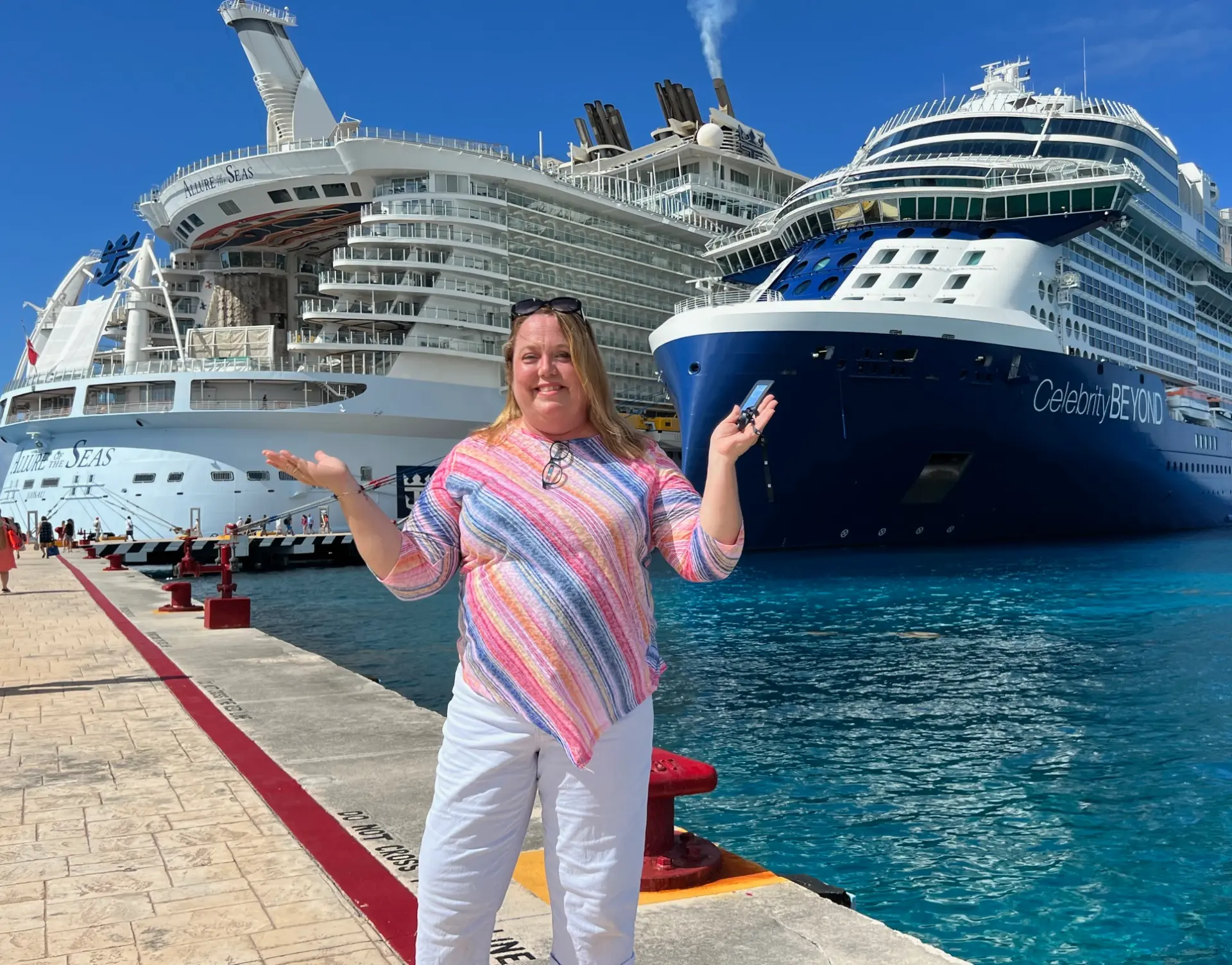 Christine dockside in port with Royal Caribbean's Allure of the Seas and Celebrity Beyond docked side by side behind her